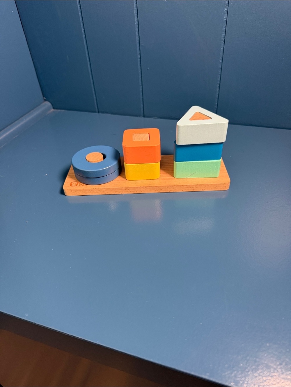Wooden Shape Stacker Toy in Blue, Orange, Yellow, Green, and White